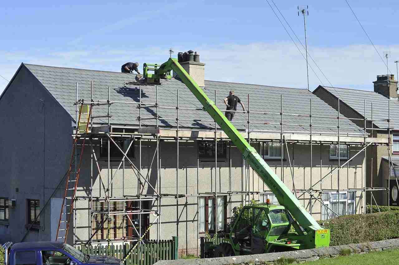 Commercial roofing team working on a large building in Austin, TX