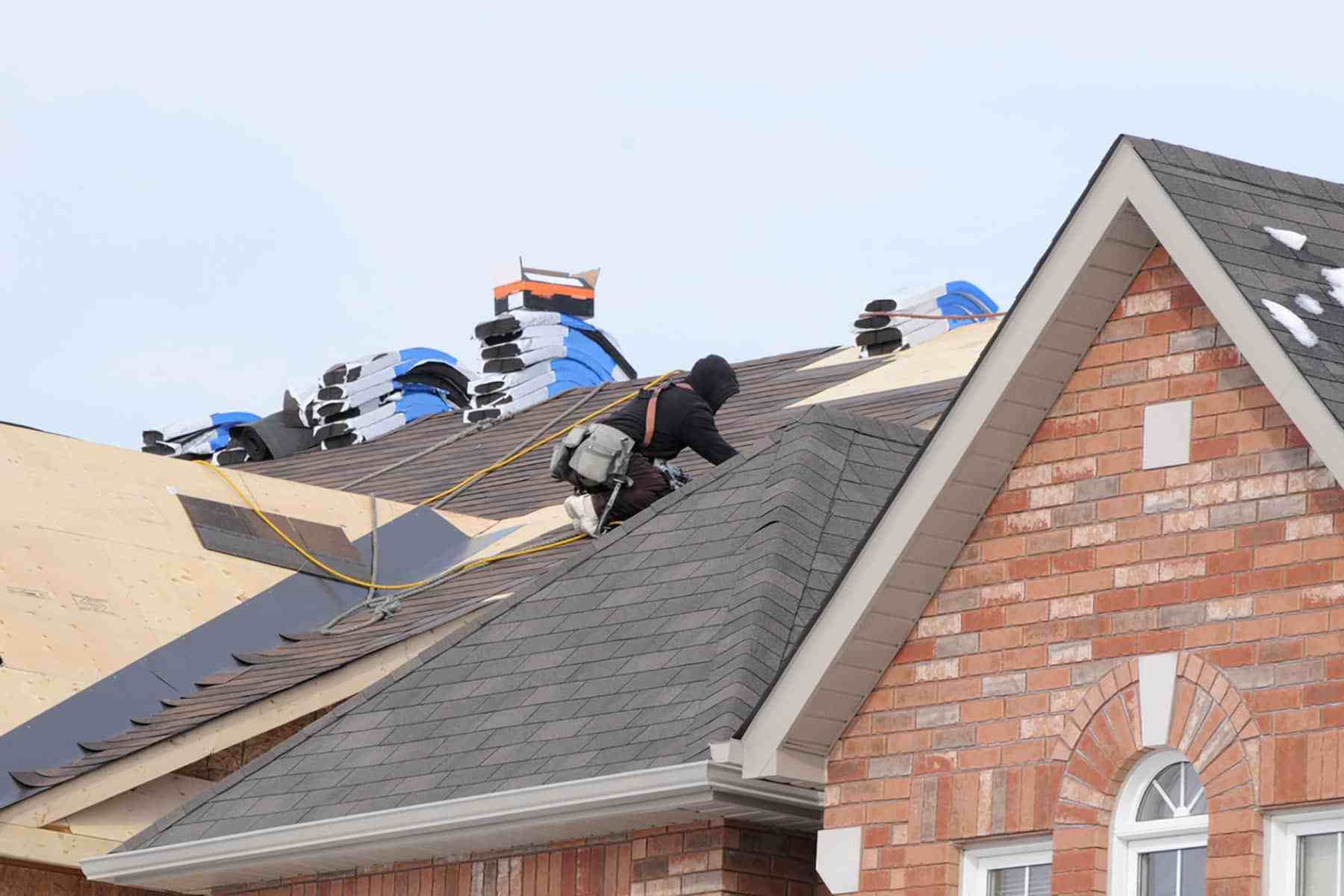 Roofer installing a new roof on a home in Austin, TX