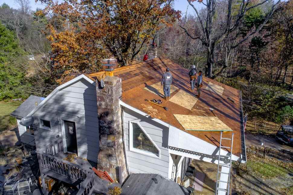 Roofer installing a new roof on a home in Austin, TX