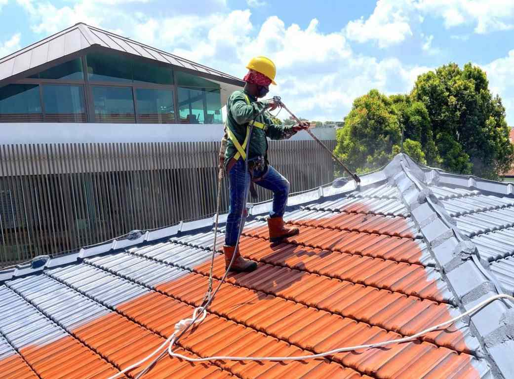 Waterproofing team applying protective coating on a building in Austin, TX