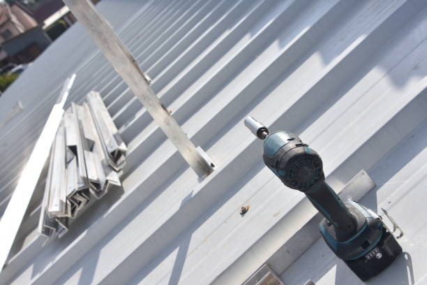 new asphalt roof installation by professional roofing contractors team onsite