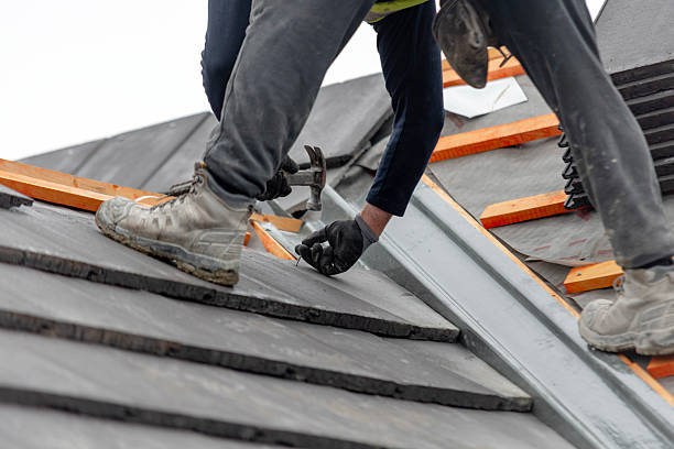 Homey Roofing applying weatherproof roofing materials on residential property