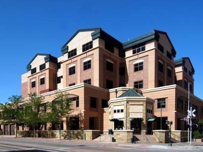 Professional roofer repairing a roof in Larimer County, CO