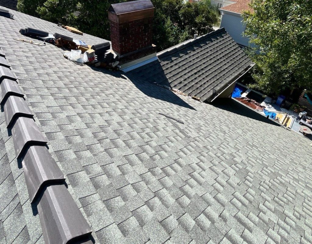 Commercial roofing team working on a large building in Austin, TX
