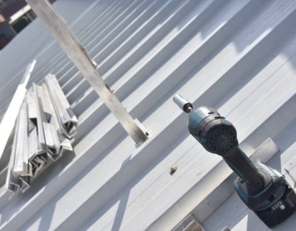 new asphalt roof installation by professional roofing contractors team onsite