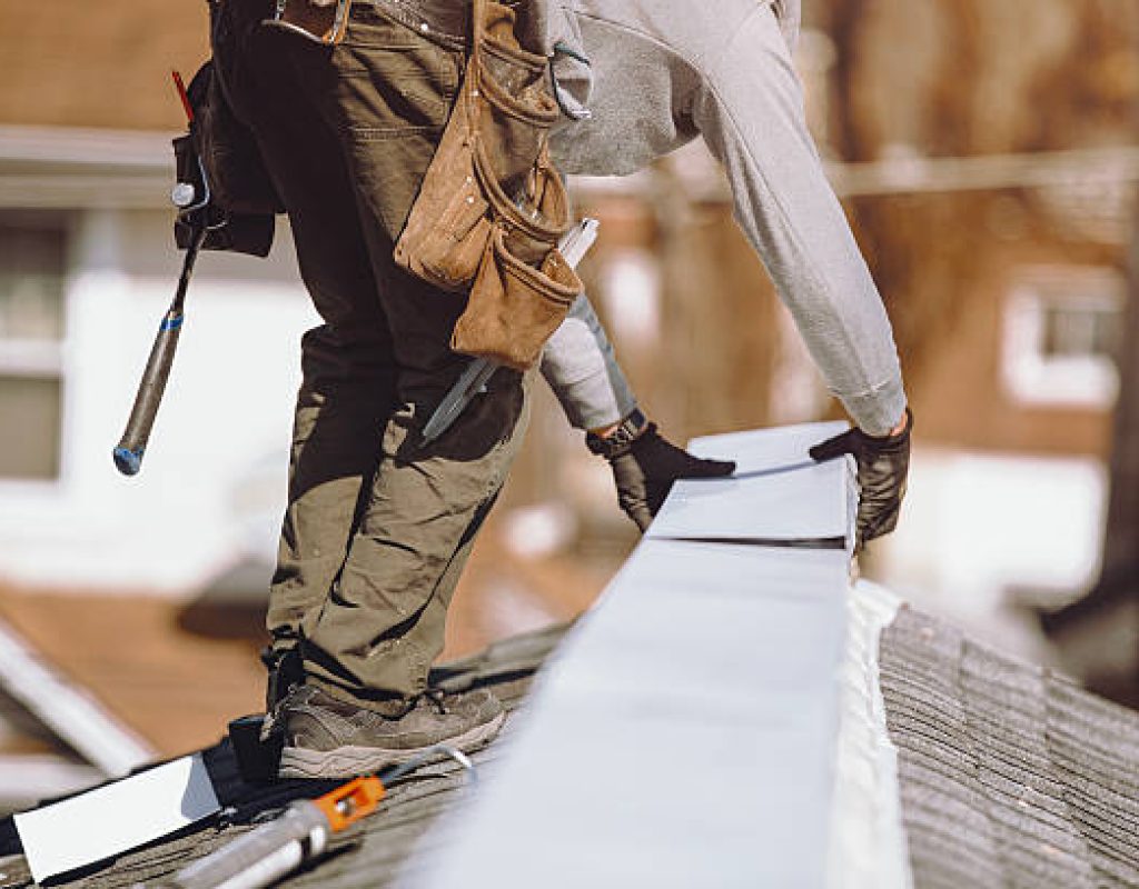 Skilled technicians performing expert roof installation for homeowners