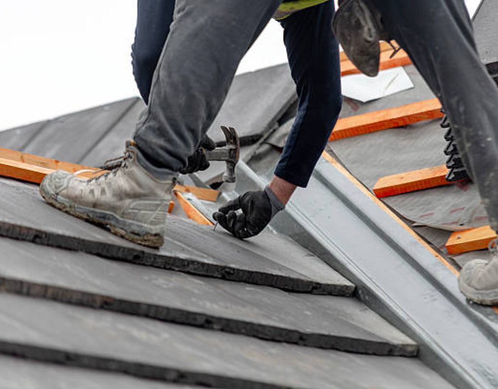 Homey Roofing applying weatherproof roofing materials on residential property